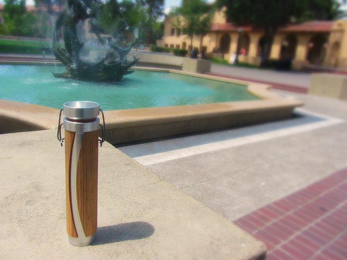 Photo of the finished thermos in front of a fountain